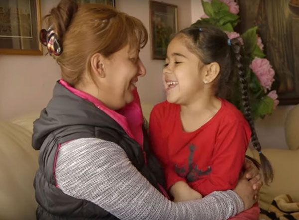 Happy Roma family in slums settlements