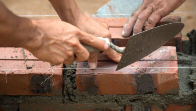 Volunteers building in Myanmar with bricks