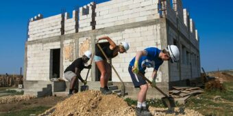 volunteers building social housing romania