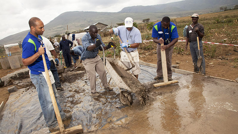 Volunteers building homes for victims of violence in Kenya