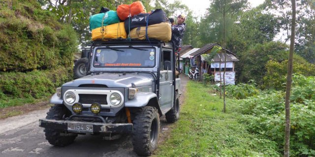 jeep carrying supplies in indonesia