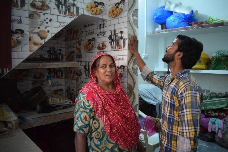 Khalida in India Bawana in her new home after women build