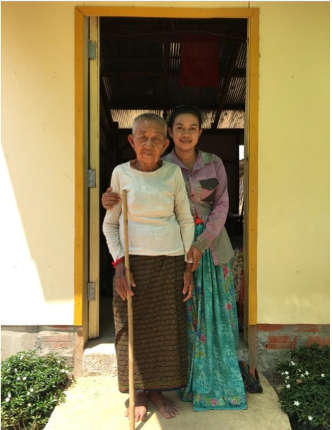 Khut and Lina at the door to their new home. Cambodia CISCO