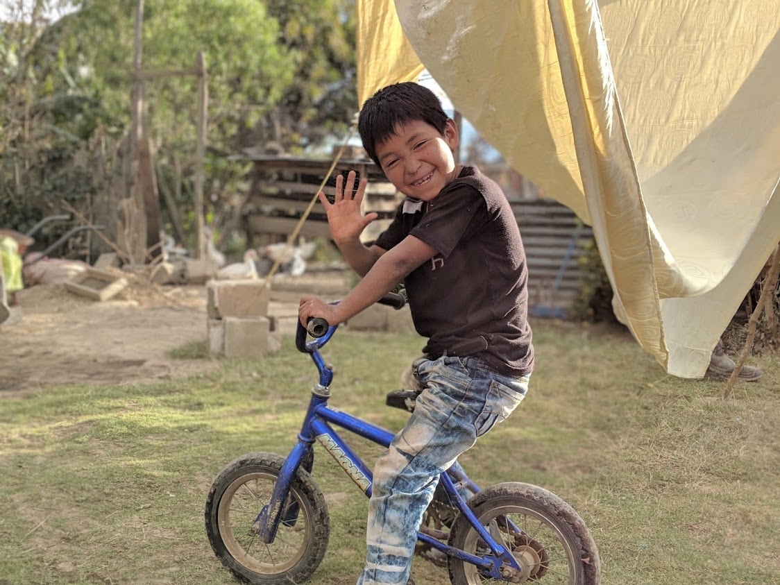 Guatemala boy on bike