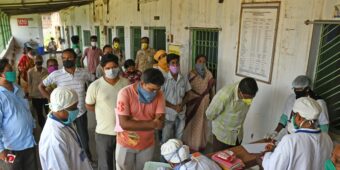 people gathering to receive medical support - Covid 19 response by Habitat for Humanity Great Britain