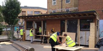 volunteers on construction site support Habitat for Humanity in the United Kingdom