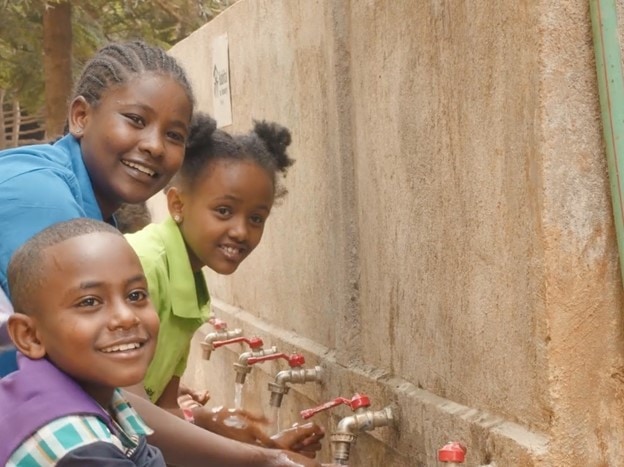 in the slums of Ethiopia a local school has a new hydration station where children can wash their hands - Habitat for Humanity Great Britain