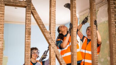 three women build at a veterans house on a Habitat for Humanity Great Britain project