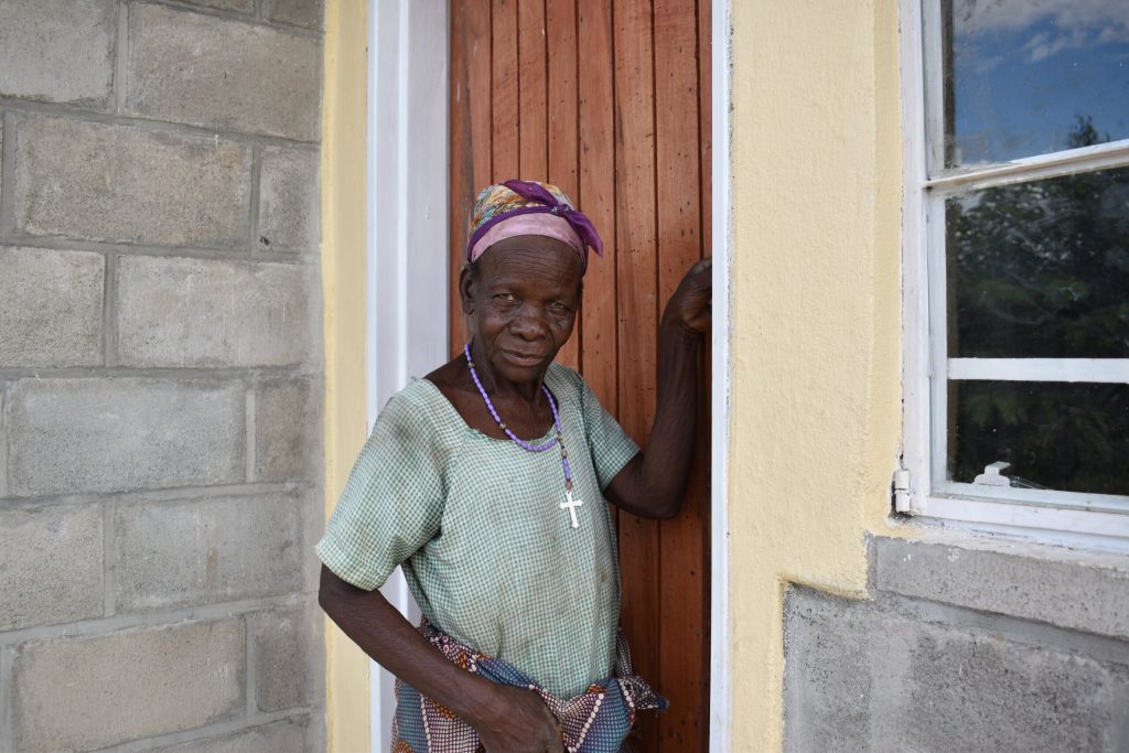 Ester-Foster-stnding-in-front-of-her-new-house-UNDP-China-Project-Jenala-Phalombe-2-April-2021 Malawi