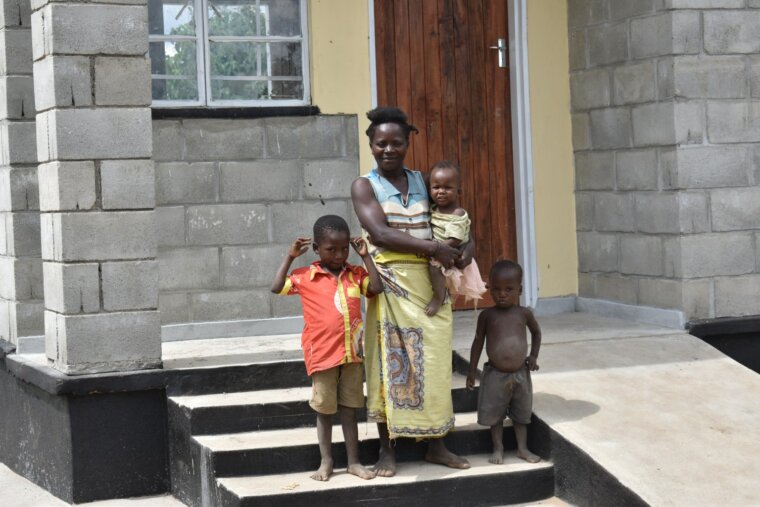 Mary-Mofolo-and-family-infront-of-their-house-Jenala-Phalombe-18-May-2021 Malawi