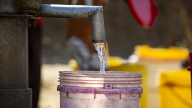 a bucket and a tap with water