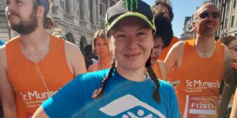 Katie Chedgey stands for a photo after running the marathon for Habitat for Humanity Great Britain