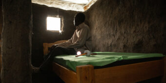 KISUMU, KENYA-MARCH 15, 2022: Identifying Housing Design Solutions That Prevent The Entry Of Mosquitoes Into Homes. Caleb Odoyo is seated inside a model hut in a controlled environment at Center of Global Health Research (KEMRI) in Kisumu Kenya. The Terwiliger Center for Innovation in Shelter provides resources in Kisumu, Kenya aimed at helping to identify housing design solutions that prevent the entry of mosquitoes into homes.