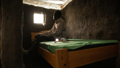 KISUMU, KENYA-MARCH 15, 2022: Identifying Housing Design Solutions That Prevent The Entry Of Mosquitoes Into Homes. Caleb Odoyo is seated inside a model hut in a controlled environment at Center of Global Health Research (KEMRI) in Kisumu Kenya. The Terwiliger Center for Innovation in Shelter provides resources in Kisumu, Kenya aimed at helping to identify housing design solutions that prevent the entry of mosquitoes into homes.