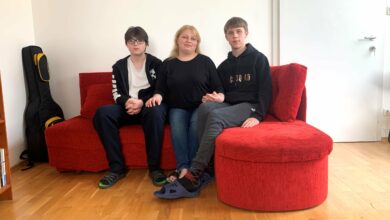 (Budapest, Hungary)- Valentina (center) and her teenaged sons Vitalik (left) and Vladik in their temporary apartment in Hungary’s capital, Budapest, on May 4, 2022. They came from Khmelnitskiy city in western Ukraine and crossed the Ukrainian-Hungarian border in early March 2022. In the first couple of weeks, they stayed in a workers’ hostel in Miskolc city in northeastern Hungary. Later they found mid-term accommodation in Budapest through a joint program by Habitat for Humanity Hungary, From Streets to Homes Association and The City is for All. Valentina and her sons moved into the temporary apartment in April 2022 and could stay in it until the end of June. Habitat for Humanity Hungary/ Zsoka Molnar