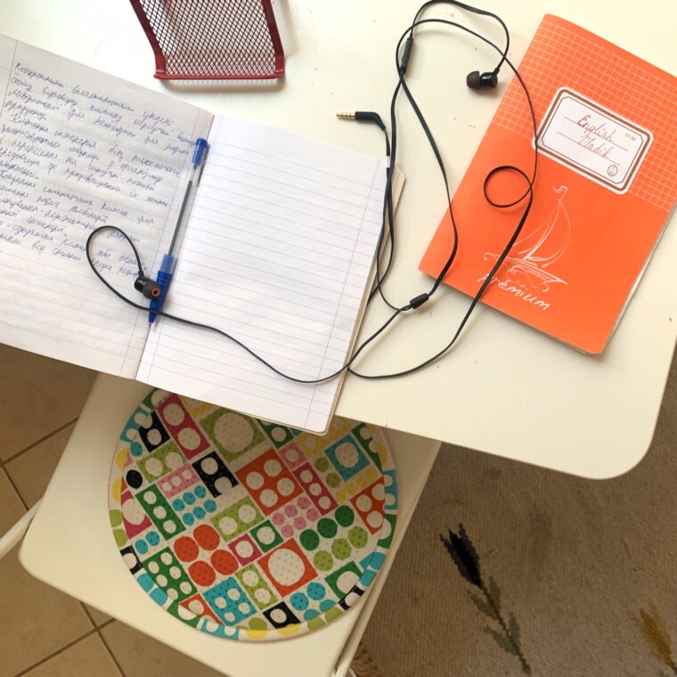 Refugees from Ukraine study in Hungary at their new online school. note books