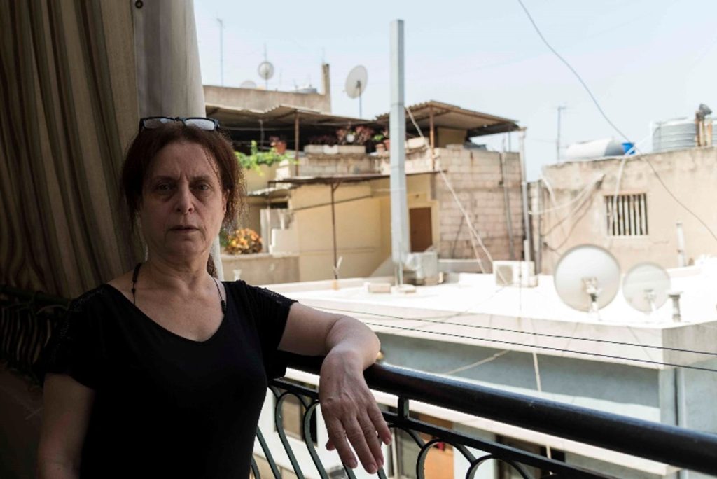 deebeh - lebanon - STANDING ON HER BALCONY
