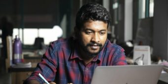 man sits at his computer - digital laptop