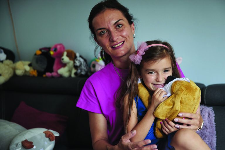 Iryna (50), and her daughter Kira (5) from Mariupol, Ukraine at their Habitat-subsidized apartment in Warsaw, Poland.