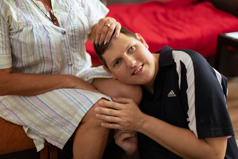 Denys, a Ukrainian refugee with Down's syndrome embracing his mother, Tetiana