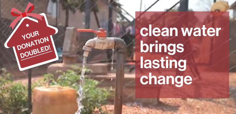 A clear stream of water flowing through a lush landscape, symbolizing the transformative power of clean water for communities. Text box to the right reads 'clean water brings lasting change'. To the left is a house shaped sticker stating 'Your donation doubled!'