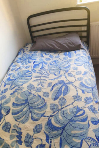 A bed and bedding provided to a woman and her child by Habitat for Humanity Great Britain’s Community Hub in Romford, supporting families in housing poverty.
