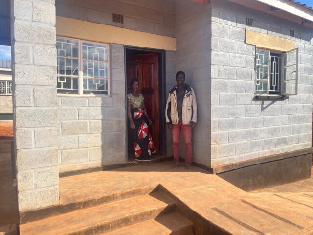 Austin and Ginny outside their new Habitat for Humanity home 