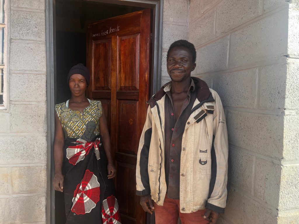 Austin and Ginny closeup outside their new Habitat for Humanity home