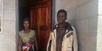 Austin and Ginny closeup outside their new Habitat for Humanity home