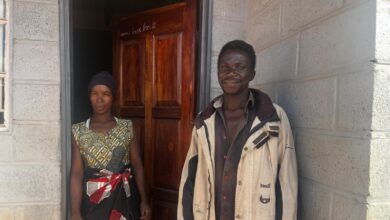 Austin and Ginny closeup outside their new Habitat for Humanity home