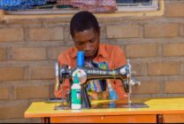 Closeup of Imraan Chisanga an 18 year old tailor trained by Habitat for Humanity Malawi after Cyclone Freddy