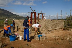 Volunteers building a home on a Global Village build in Malawi