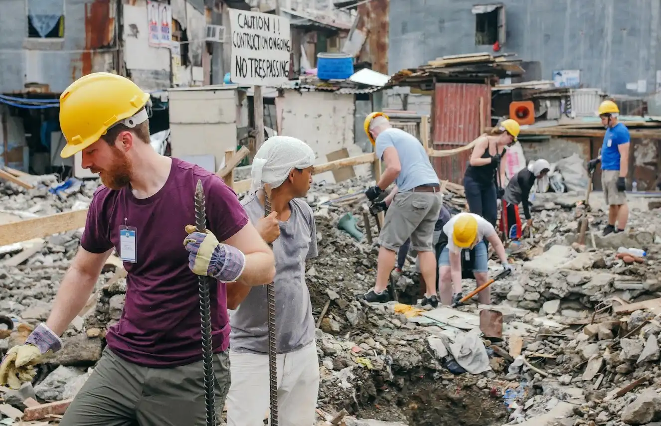 Volunteers clearing rubble.